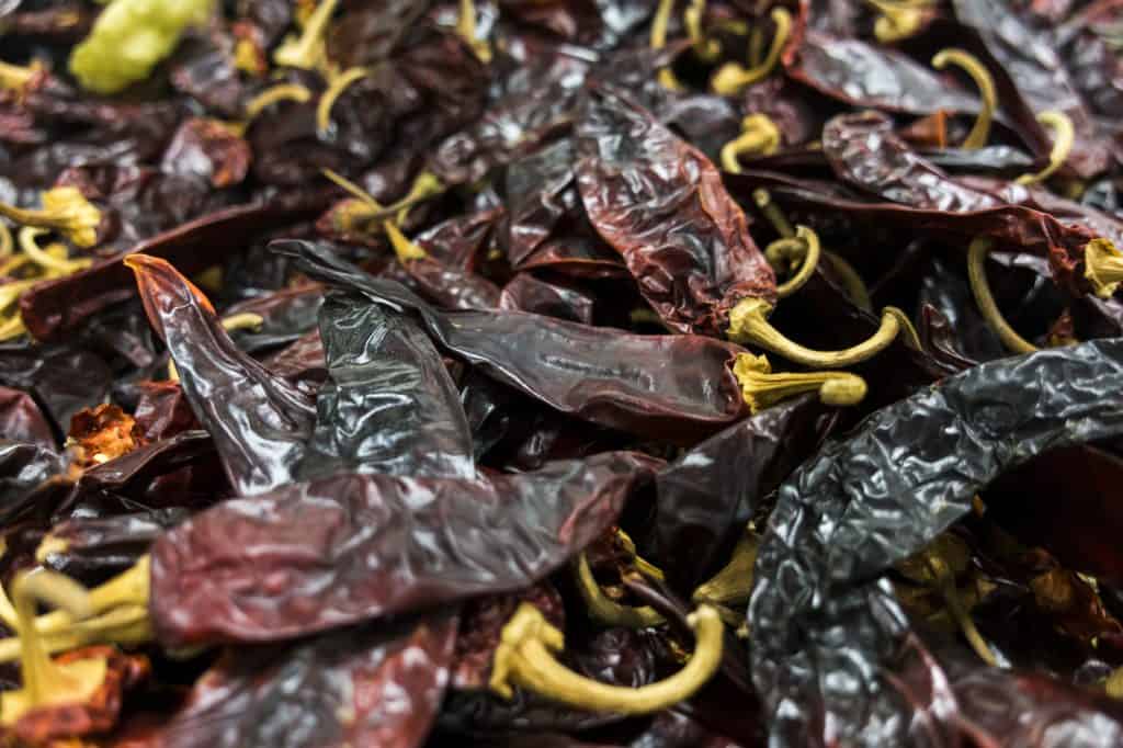 a background of many dried guajillo chili peppers.