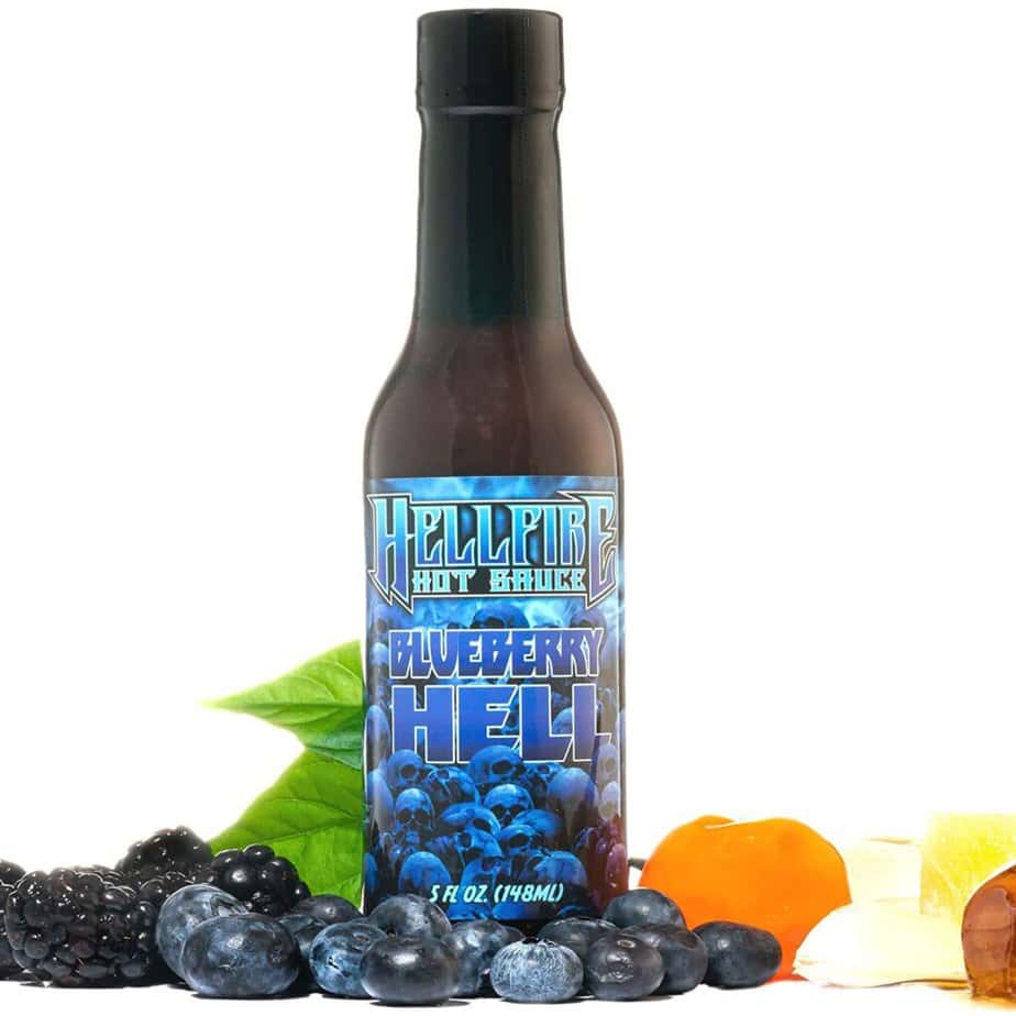 hellfire blueberry hot sauce surrounded by fruit