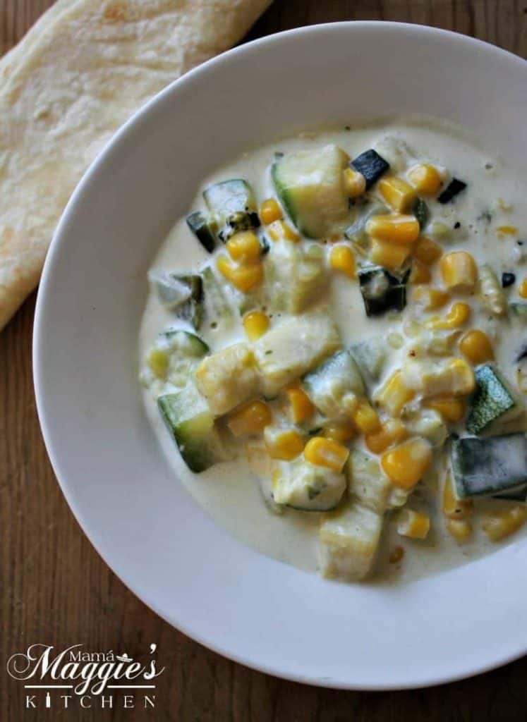 bowl of creamy corn and zucchini.