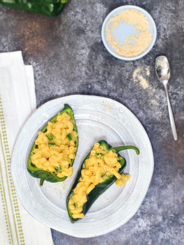 two pepper halves stuffed with mac and cheese.