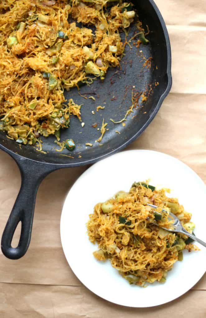 plate of squash next to cast iron skillet.