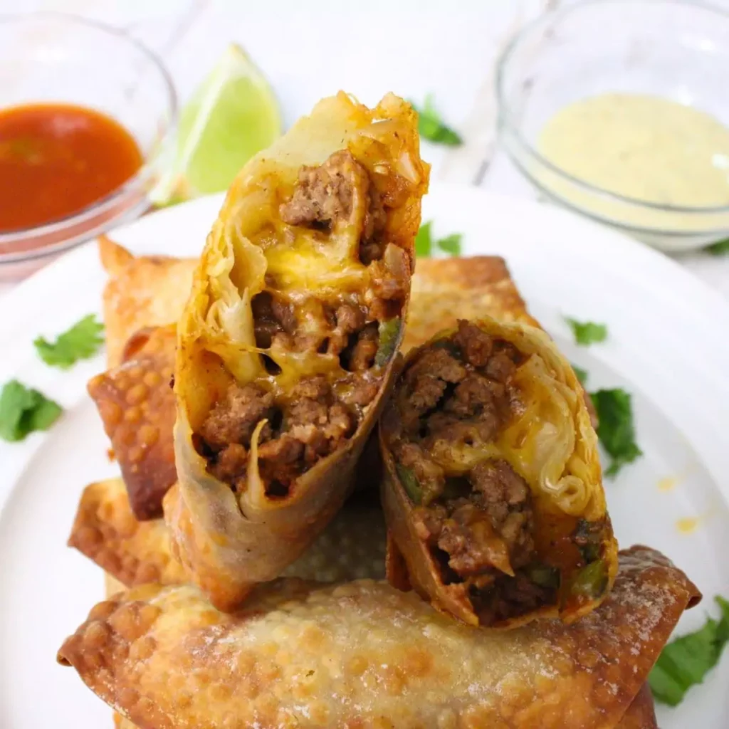 egg rolls arranged on a plate.