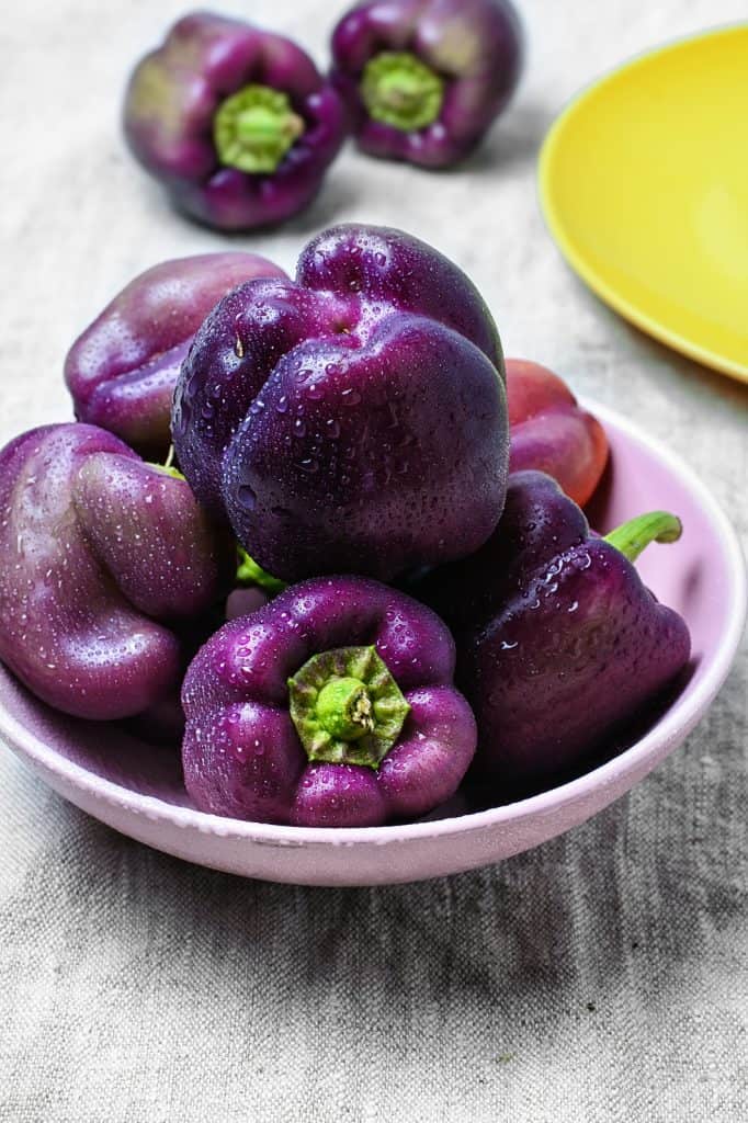 purple bell peppers in a dish.