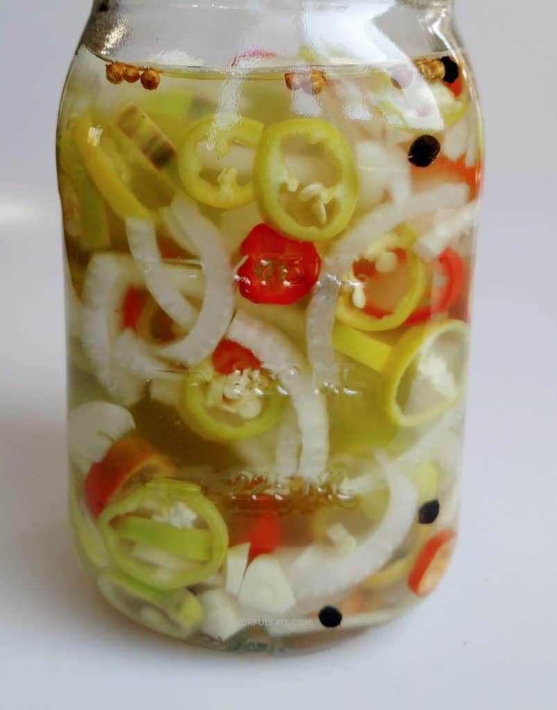 a large jar of pepper rings and onions.