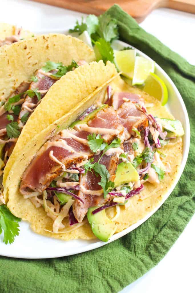 two tacos with seared tuna.