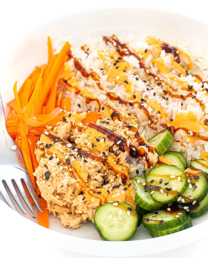 spicy tuna bowl with carrots and cucumbers.