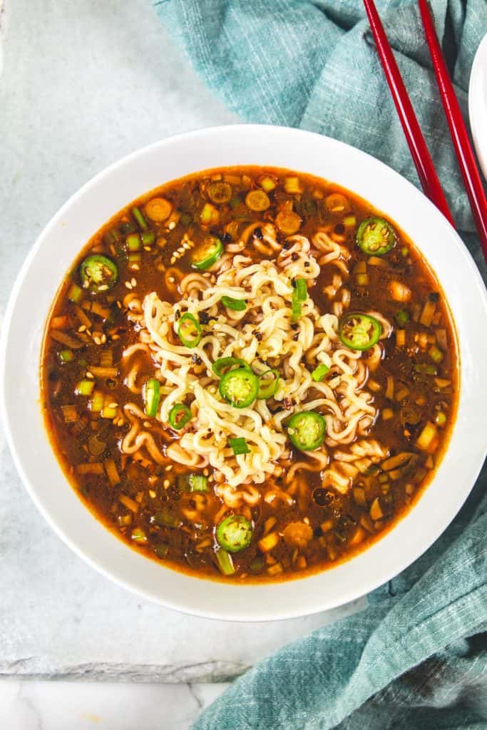 bowl of ramen with green chili slices.