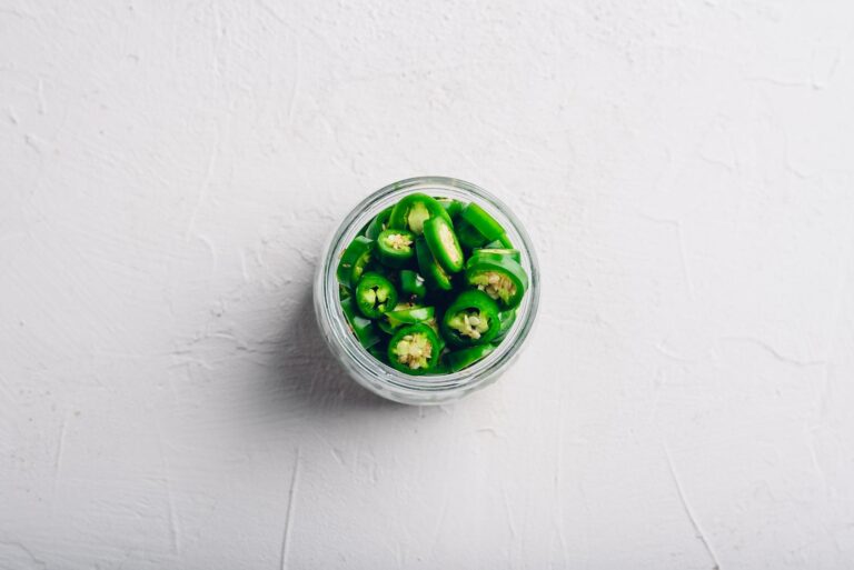 pickled jalapenos in a small jar